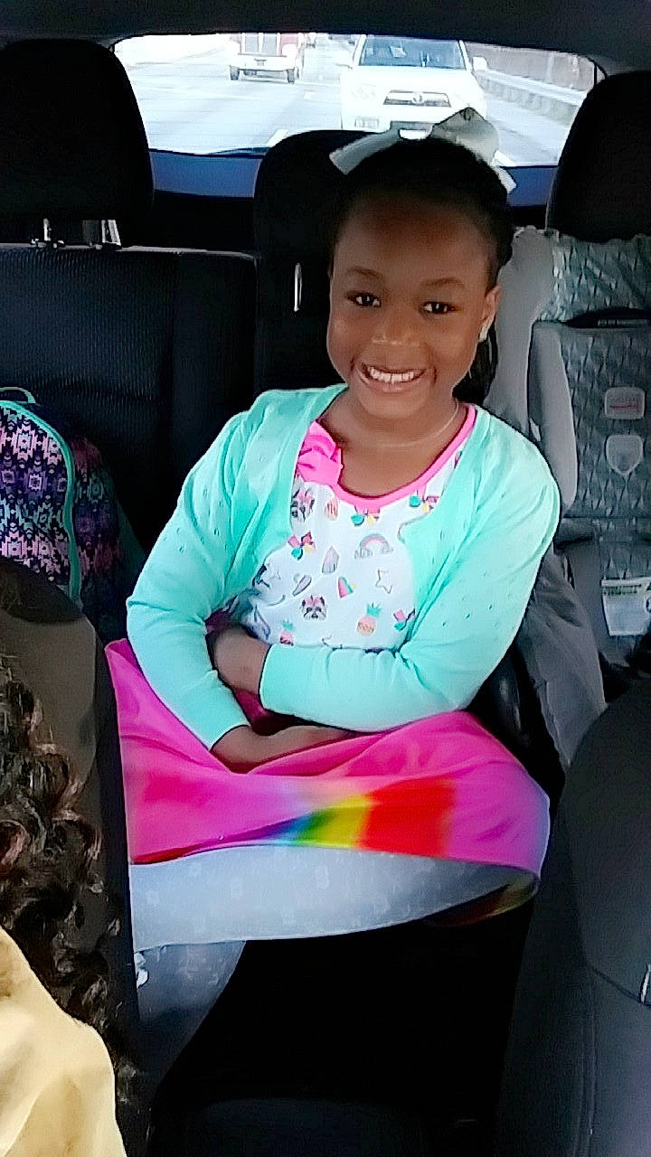 Destyni is registered to the contest to win money with this photo: car, car_seat, child, joy, person, pink, plant, play, sitting, smile, toddler, vacation