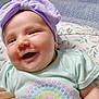 baby, child, smiling, headband, purple, pastel_colors, flower_pattern, hand, nail_polish, clothing, infant, cute, portrait, happy, closeup, soft_texture, indoor, face, person, toddler