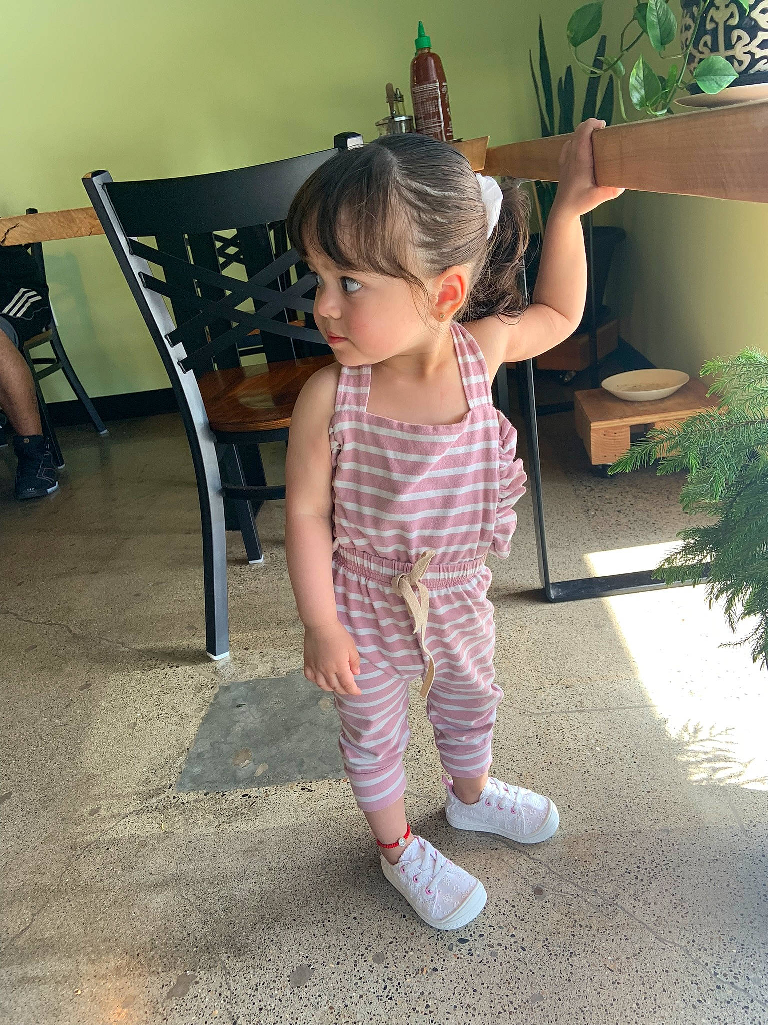 Melani joined the competition — help win amazing prizes! baby_toddler_clothing, chair, child, floor, flooring, fun, happy, hat, houseplant, human_leg, knee, pattern, person, plant, shoulder, sleeve, standing, thigh, toddler, trunk