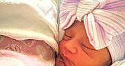 Isla Anani joined the competition — help win amazing prizes! newborn, baby, sleeping, blanket, bow, hat, infant, cute, soft, wrapped, peaceful, portrait, closeup, child, toddler, indoors, cozy, resting, skin, headwear
