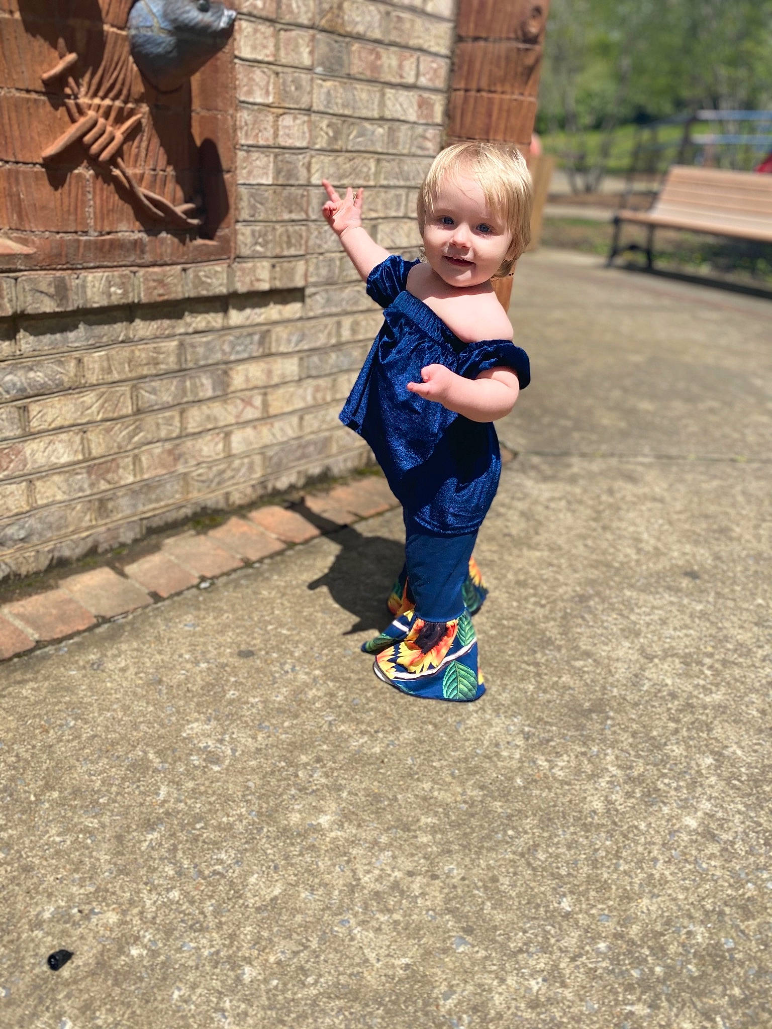 Addilynn is registered to the contest to win money with this photo: asphalt, baby, baby_toddler_clothing, bench, child, city, electric_blue, fun, grass, happy, leaf, leisure, people_in_nature, person, plant, recreation, road_surface, sitting, smile, toddler