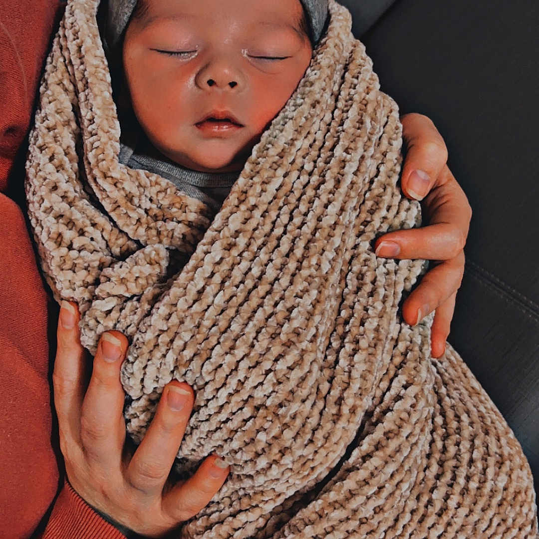 Asher is registered to the contest to win money with this photo: baby, beanie, blanket, bodypart, bonnet, cap, clothing, face, finger, hand, hat, head, homedecor, knitting, newborn, person, photography, portrait, scarf, sleeping