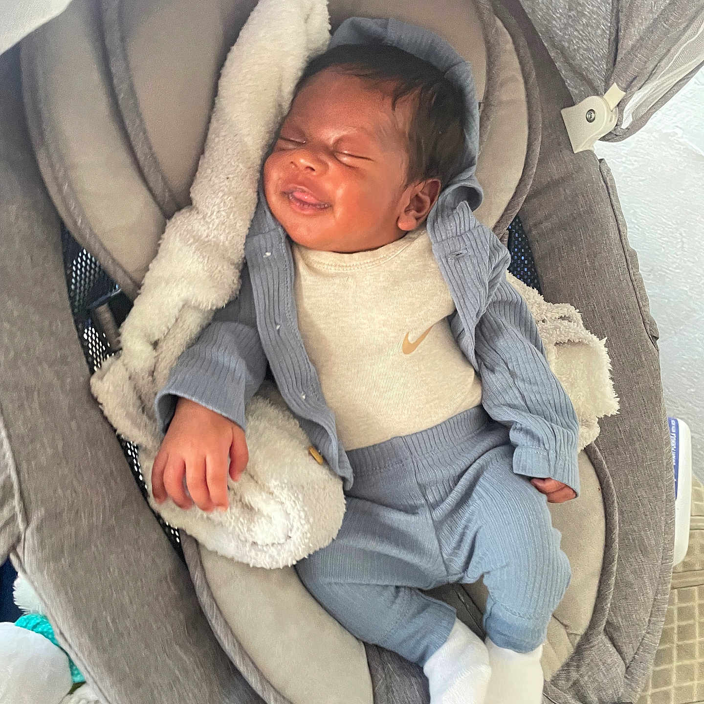 Carlos Jr joined the competition — help win amazing prizes! baby, baby_seat, blanket, child, clothing, comfort, cozy, cute, face, hand, head, indoors, infant, person, relaxation, rest, sleeping, smile, socks, soft