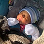 Carlos Jr joined the competition — help win amazing prizes! newborn, baby, sleeping, blanket, car_seat, mittens, beanie, cozy, infant, child, soft_lighting, clothing, closeup, portrait, indoors, cute, resting, warm, face, person