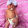 baby, newborn, infant, pacifier, bow_hat, diaper, umbilical_clamp, wristband, blanket, pink, sleeping, hospital, cozy, chubby_cheeks, legs, belly_button, skin, closeup, laying_down, cute