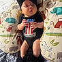 Wrenlee is registered to the contest to win money with this photo: baby, infant, newborn, headband, bow, onesie, harley_davidson, pillow, animal_print, zebra, elephant, tiger, monkey, giraffe, bedding, pattern, hands, legs, cute, indoor