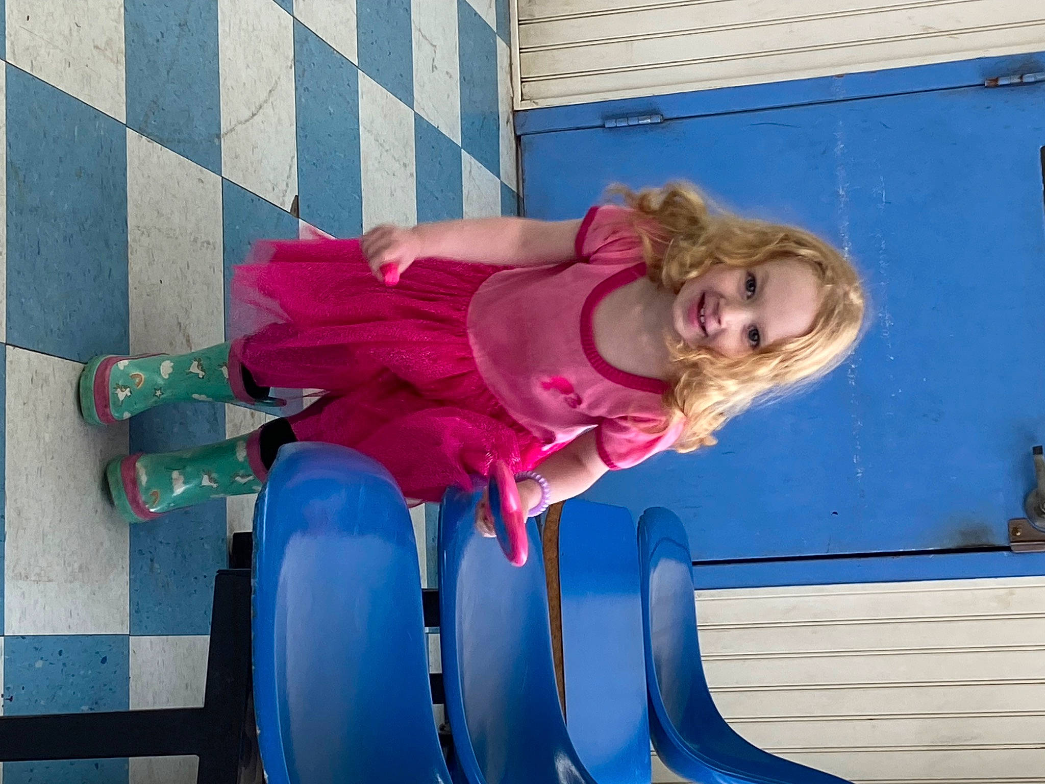 Elizabeth is registered to the contest to win money with this photo: azure, baby_toddler_clothing, blue, boats_and_boating_equipment_and_supplies, child, chute, electric_blue, fun, joy, leisure, magenta, outdoor_play_equipment, person, pink, purple, recreation, sitting, smile, toddler, vacation