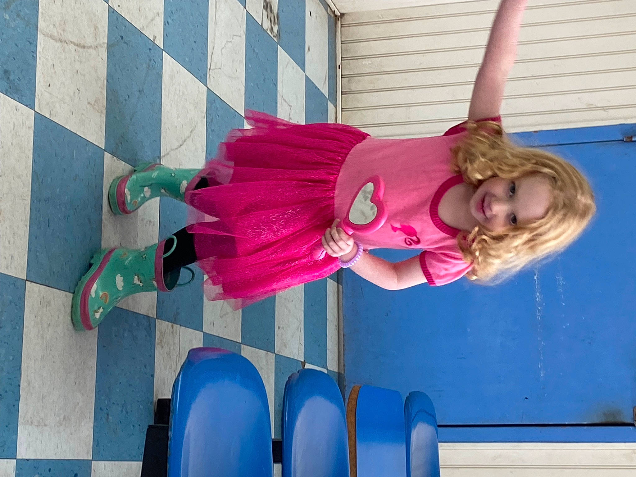 Elizabeth is registered to the contest to win money with this photo: blue, carmine, chair, child, costume, electric_blue, fictional_character, fun, human_leg, joy, leg, leisure, magenta, person, pink, plant, purple, recreation, room, sandal