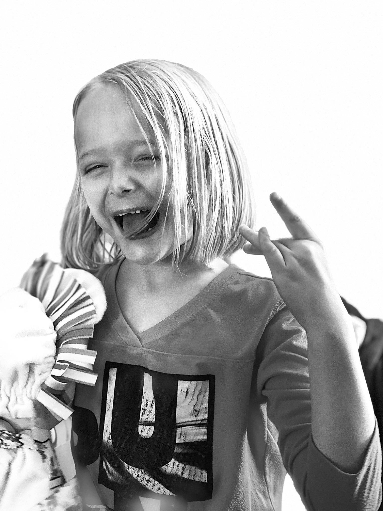 Marjorie is registered to the contest to win money with this photo: arm, audio_equipment, black, black_and_white, elbow, eye, finger, flash_photography, fun, gesture, hand, happy, headwear, microphone, monochrome, monochrome_photography, music, person, smile, style