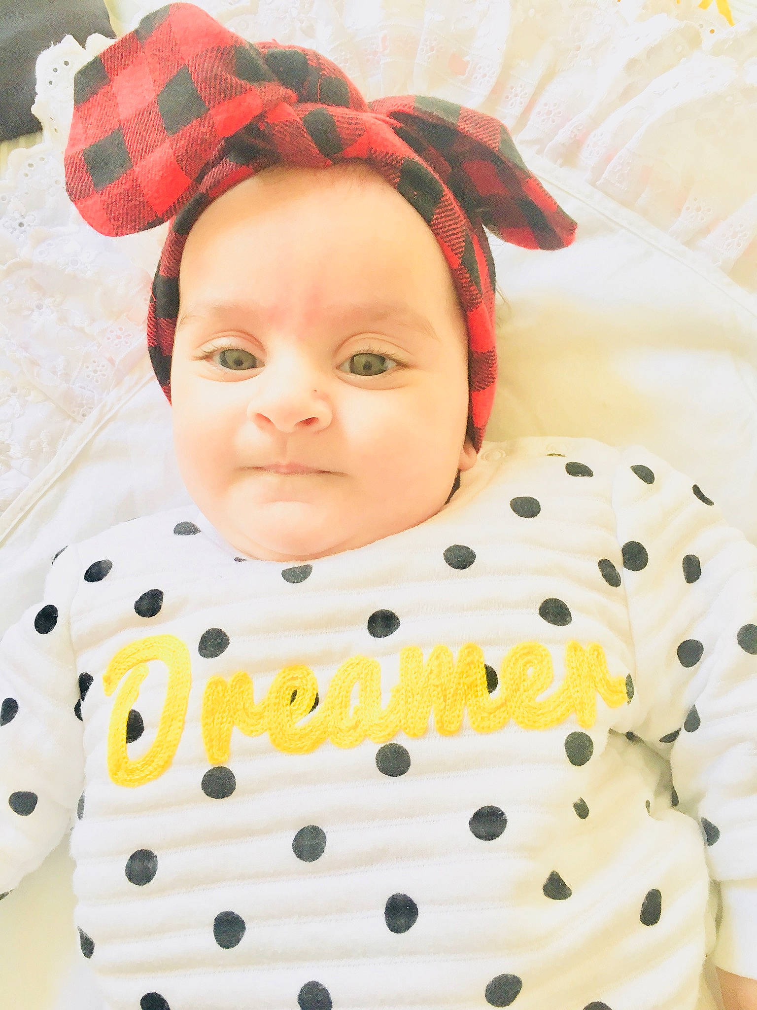 Jasmin is registered to the contest to win money with this photo: baby, baby_toddler_clothing, cheek, child, design, hair_accessory, headgear, outerwear, pattern, person, polka_dot, sleeve, smile, textile, toddler