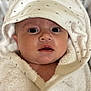 Louise participe au concours pour gagner de l'argent avec cette photo : baby, infant, face, eyes, towel, hood, white, soft, cute, closeup, portrait, skin, expression, indoors, newborn, child, wrapped, warm, adorable, star_pattern