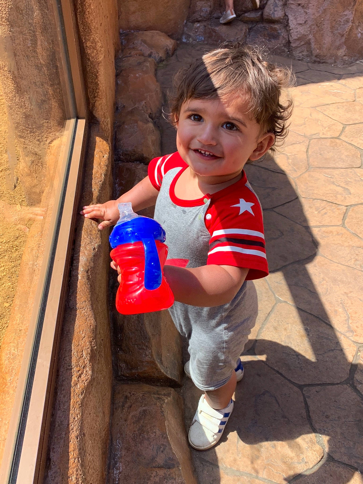 Jai is registered to the contest to win money with this photo: child, joy, person, play, red, smile, toddler, vacation, water