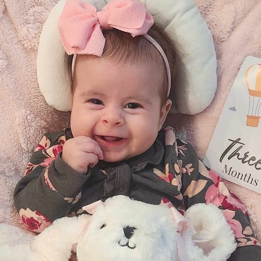 Sophia is registered to the contest to win money with this photo: accessories, baby, baseballcap, bonnet, cap, clothing, coat, cushion, face, happy, hat, head, homedecor, jacket, laughing, newborn, person, photography, portrait, smile
