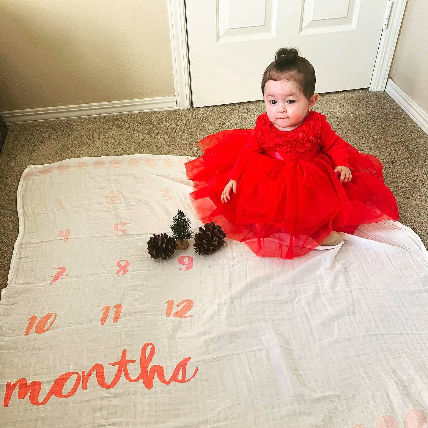 Ayanna joined the competition — help win amazing prizes! baby_toddler_clothing, bed, bed_sheet, bedding, bedroom, blanket, comfort, costume, door, duvet, floor, flooring, fur, home_accessories, linens, person, red, room, sitting, textile