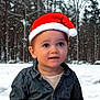 toddler, child, santa_hat, denim_shirt, winter, snow, forest, outdoor, portrait, cute, holiday, christmas, seasonal, young_child, smiling, winter_clothing, face, headwear, snowfall, nature