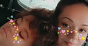 Noah is registered to the contest to win money with this photo: affection, car_interior, casual_clothing, child, closeup, curly_hair, emojis, face_filter, friendship, hearts, love, passenger, people, portrait, relaxing, seat, sleeping, vehicle, window, woman