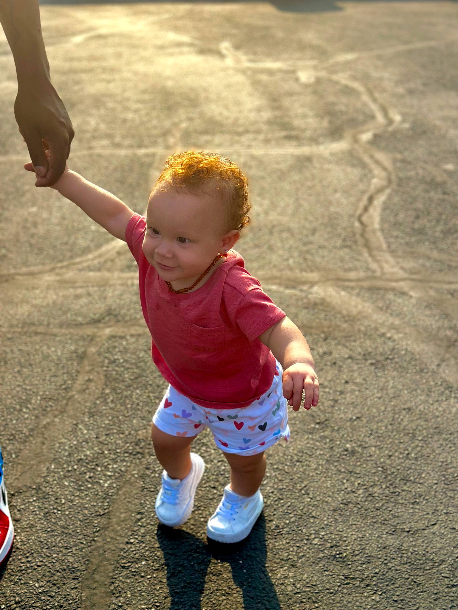 Alaya is registered to the contest to win money with this photo: asphalt, baby, child, facial_expression, fun, gesture, grass, hairstyle, happy, human_leg, joy, leisure, people_in_nature, person, recreation, sand, shorts, sneakers, sports, t_shirt