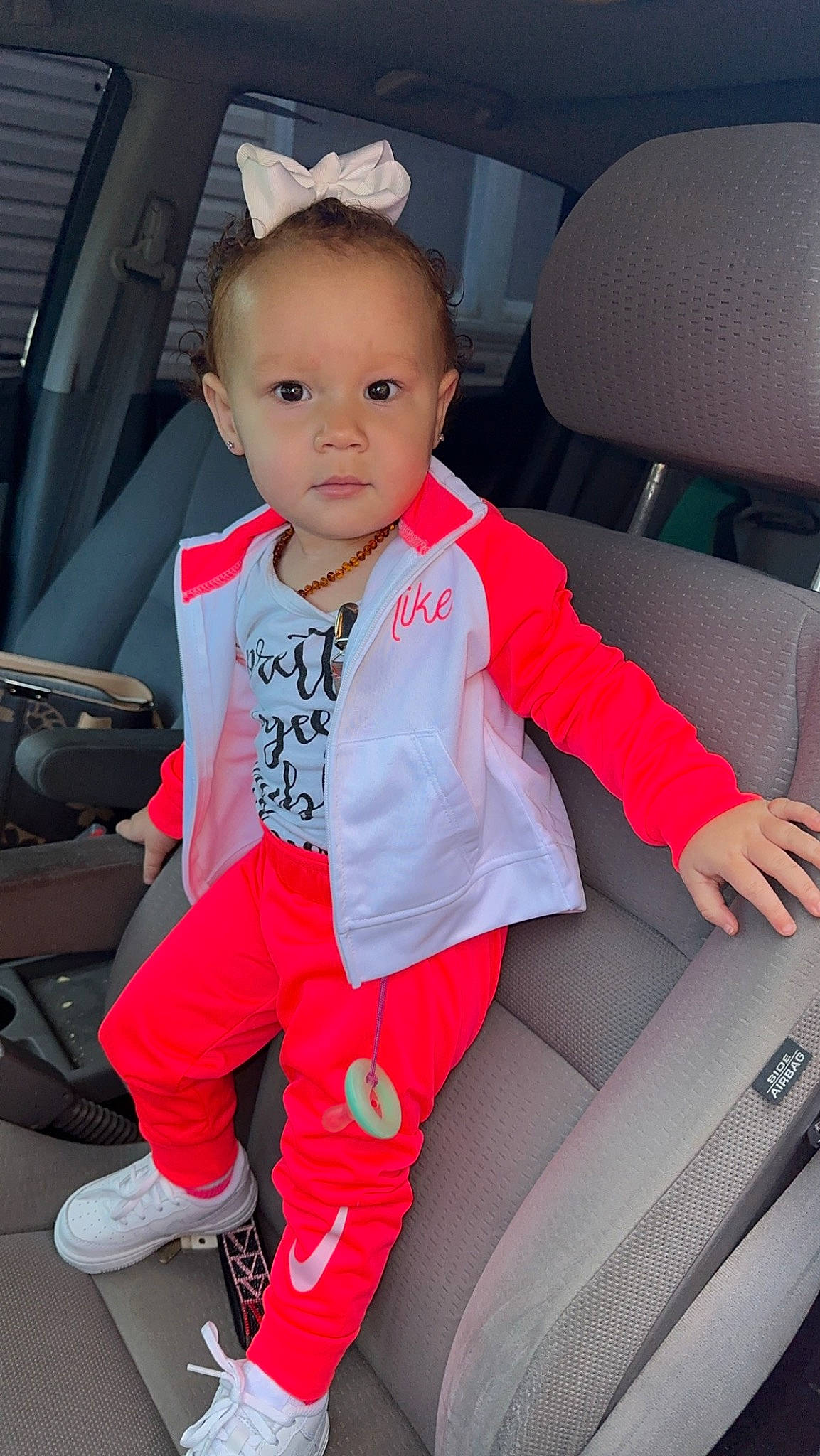 Alaya is registered to the contest to win money with this photo: auto_part, automotive_design, automotive_exterior, baby, baby_toddler_clothing, car_seat, car_seat_cover, child, comfort, electric_blue, family_car, head_restraint, human_leg, luxury_vehicle, motor_vehicle, person, sitting, sleeve, steering_wheel, toddler