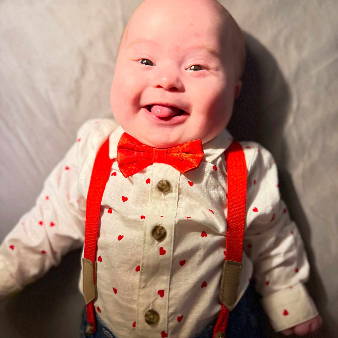 Kazmier Finn joined the competition — help win amazing prizes! baby, child, closeup, clothing, cute, denim_pants, face, fashion, happy, heart_pattern, indoor, infant, person, playful, portrait, red_bow_tie, red_suspender, smiling, tongue_out, white_shirt