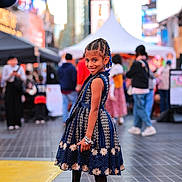 Wynter joined the competition — help win amazing prizes! child, girl, smiling, dress, braided_hair, bracelet, urban, street, city, people, crowd, footwear, posing, fashion, daylight, side_view, outdoor, happy, background_blur, public_place