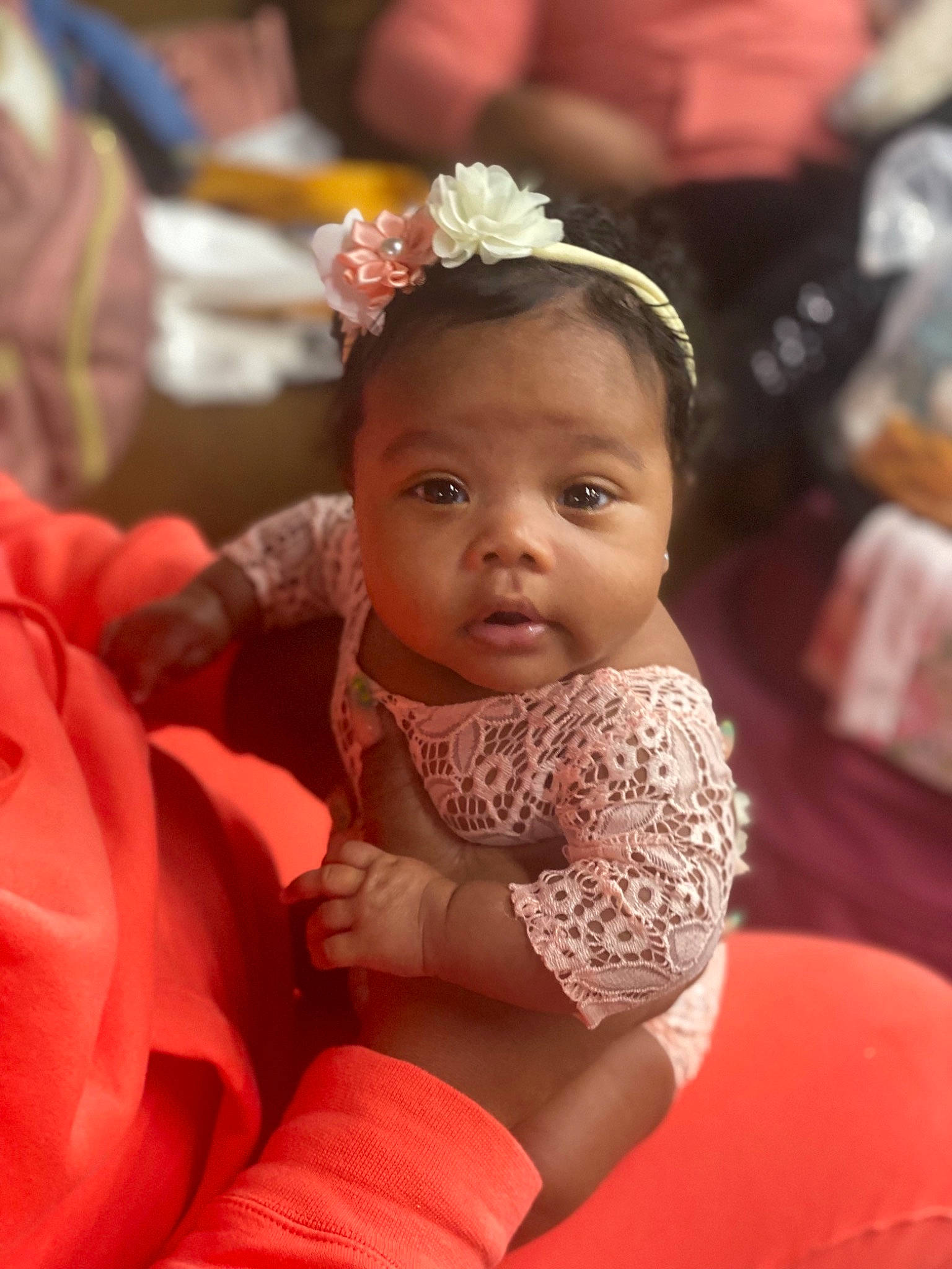 Quariah joined the competition — help win amazing prizes! baby, baby_toddler_clothing, child, dress, event, facial_expression, fashion_accessory, fun, hair_accessory, happy, headband, headpiece, jewellery, person, pink, sitting, thigh, toddler, tradition, trunk