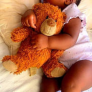 London joined the competition — help win amazing prizes! baby, infant, sleeping, teddy_bear, stuffed_animal, cuddling, bed, blanket, pajamas, dress, portrait, indoors, peaceful, resting, closed_eyes, baby_hand, baby_arm, baby_legs, soft_lighting, cozy