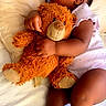 baby, infant, sleeping, teddy_bear, stuffed_animal, cuddling, bed, blanket, pajamas, dress, portrait, indoors, peaceful, resting, closed_eyes, baby_hand, baby_arm, baby_legs, soft_lighting, cozy
