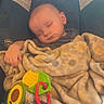 Christopher joined the competition — help win amazing prizes! baby, sleeping, car_seat, blanket, toy, polka_dot, child, infant, cute, peaceful, nap, indoor, head, hand, colorful, soft, comfort, rest, young, portrait