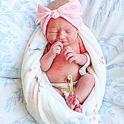 Nautica joined the competition — help win amazing prizes! newborn, baby, infant, blanket, headband, pink_bow, hospital_id, umbilical_clamp, bedspread, floral_pattern, skin, wrapped, resting, sleeping, cute, small, person, indoors, soft, peaceful
