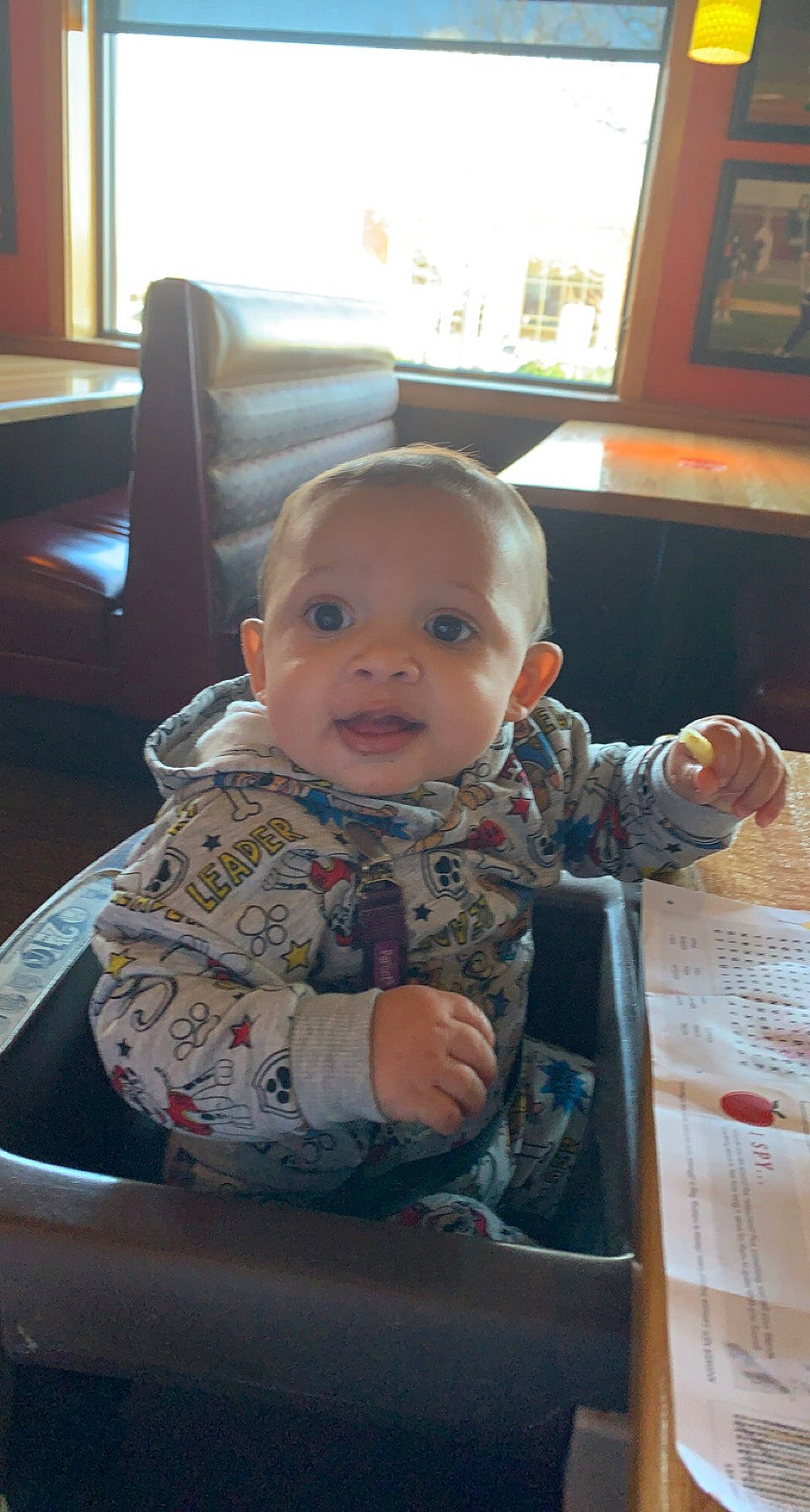 Oliver is registered to the contest to win money with this photo: baby, baby_products, baby_toddler_clothing, chair, cheek, child, comfort, flooring, fun, hardwood, lap, person, picture_frame, room, sitting, skin, sleeve, smile, toddler, varnish