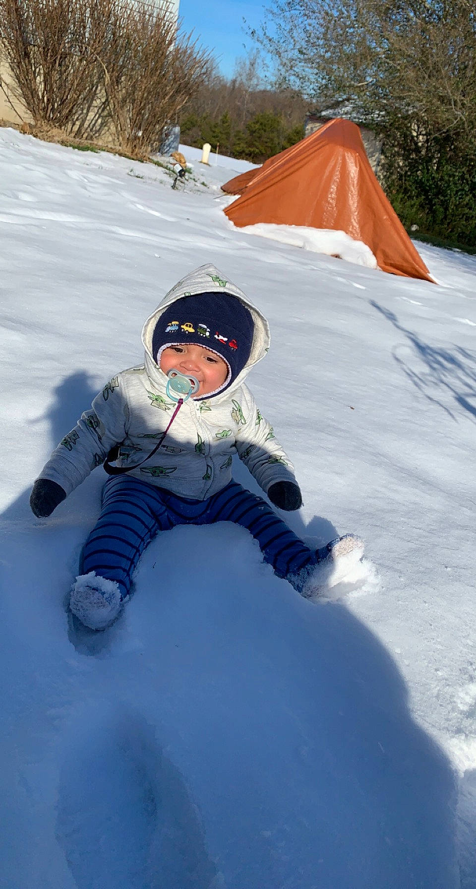 Oliver is registered to the contest to win money with this photo: electric_blue, freezing, fun, glacial_landform, glove, headwear, ice_cap, jacket, joy, leisure, people_in_nature, person, personal_protective_equipment, plant, play, playing_in_the_snow, recreation, slope, snow, tent