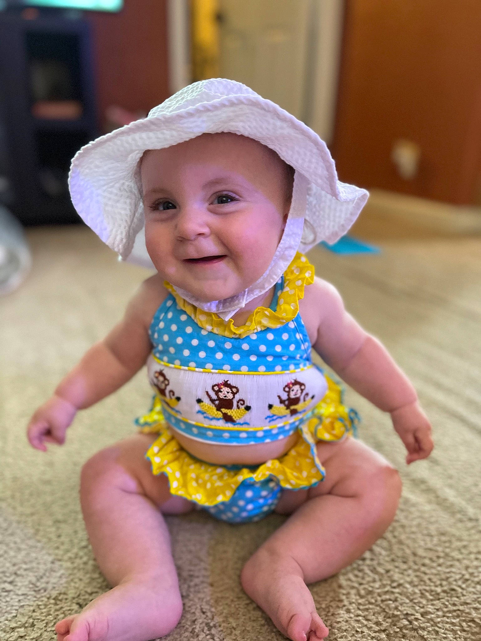 Mila Grace is registered to the contest to win money with this photo: baby, baby_toddler_clothing, cheek, clothing, dress, eye, face, facial_expression, fun, happy, hat, head, headwear, iris, joy, person, pink, purple, skin, sleeve