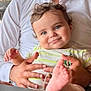 baby, child, smiling, blue_eyes, curly_hair, infant, hands, foot, person, holding, white_shirt, striped_clothing, cute, portrait, indoor, closeup, happy, skin, toddler, family