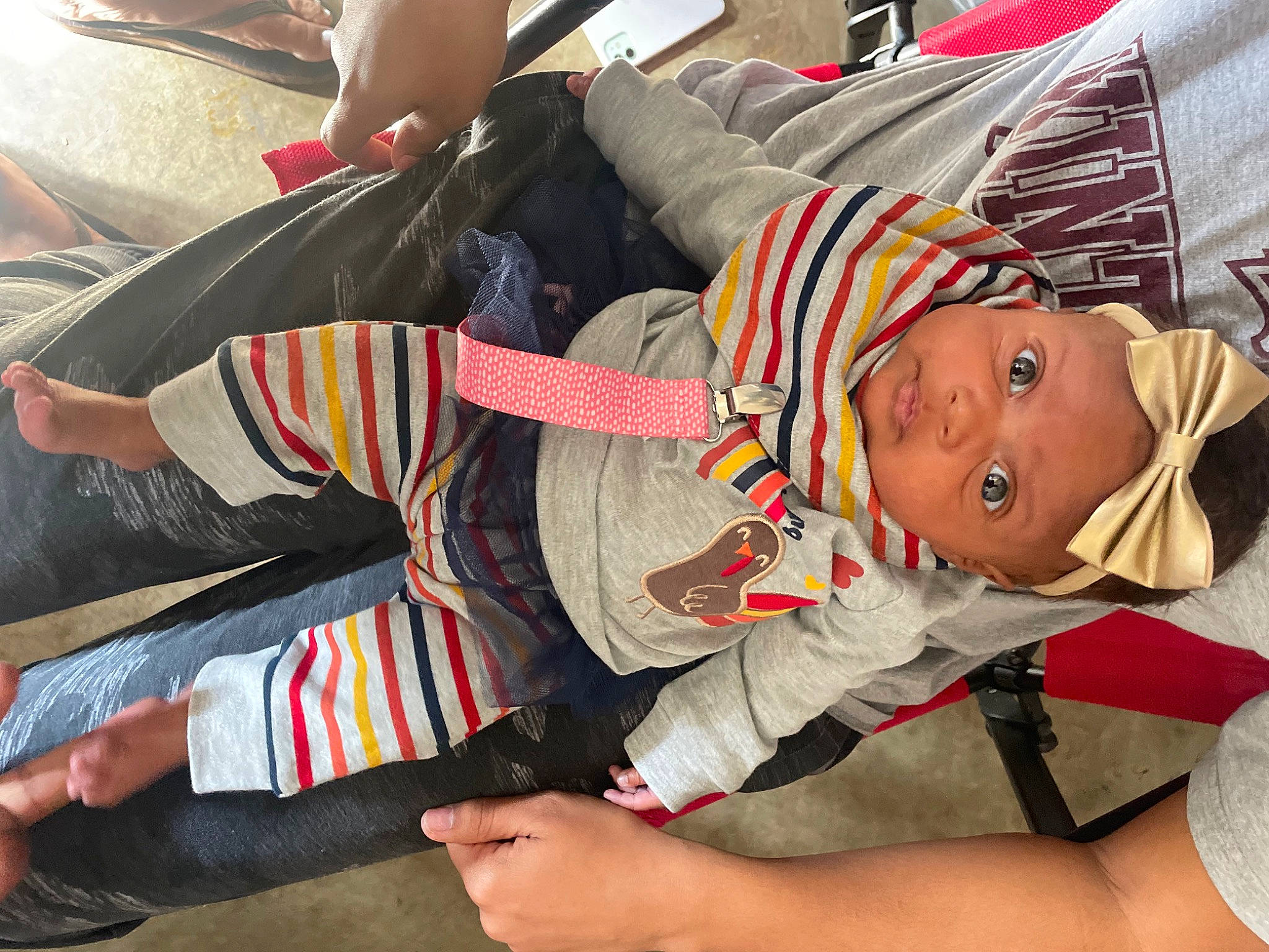 Kali joined the competition — help win amazing prizes! baby, baby_products, baby_toddler_clothing, carmine, child, comfort, elbow, facial_expression, fun, hat, headwear, human_leg, knee, lap, mouth, pattern, person, sitting, sock, textile