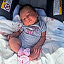Scarlett is registered to the contest to win money with this photo: baby, baby_girl, blanket, car_seat, child, clothing, comfort, cozy, cute, face, happy, indoors, infant, newborn, onesie, pink_socks, portrait, resting, smile, soft
