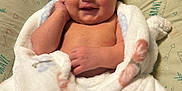 Scarlett is registered to the contest to win money with this photo: newborn, baby, blanket, smile, sleeping, infant, cozy, soft, pillow, wrapped, cute, peaceful, resting, child, indoors, person, portrait, skin, happy, toddler