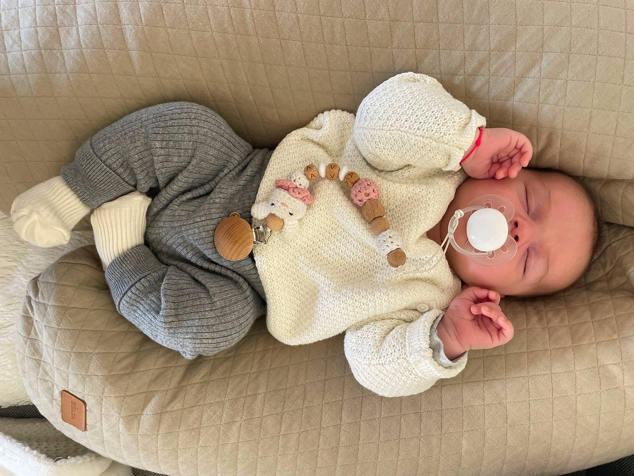 Ava participe au concours pour gagner de l'argent avec cette photo : baby, baby_products, baby_sleeping, baby_toddler_clothing, bedtime, child, comfort, hand, headgear, human_body, leg, linens, nap, pattern, person, room, skin, textile, toddler, wood