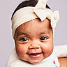Ashley a rejoint le concours — aidez-le/la à gagner de superbes lots ! baby, child, smiling, headband, bow, face, portrait, cute, happy, infant, closeup, skin, eyes, cheeks, clothing, person, background, headwear, expression, young