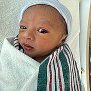 Kazi Zayan Ali joined the competition — help win amazing prizes! baby, blanket, child, closeup, cute, expression, eyes, face, hat, hospital, indoors, infant, newborn, newborn_baby, person, portrait, skin, striped, swaddled, wrapped