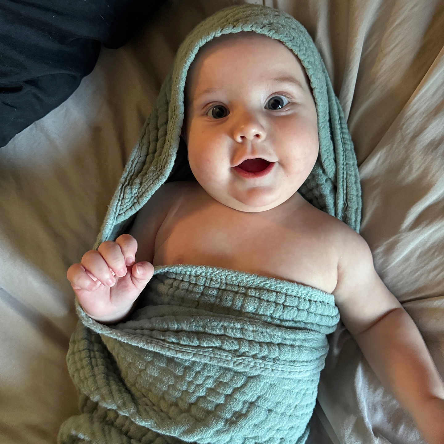 Coleson is registered to the contest to win money with this photo: baby, bed, blanket, child, comfort, cute, eyes, face, hand, happy, indoors, infant, mouth, rest, skin, smiling, soft, texture, towel, wrapped