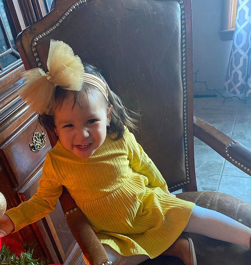 Gianna joined the competition — help win amazing prizes! baby_products, baby_toddler_clothing, bookcase, chair, child, comfort, fun, happy, leisure, person, plant, sitting, smile, thigh, toddler, travel, vacation, vehicle_door