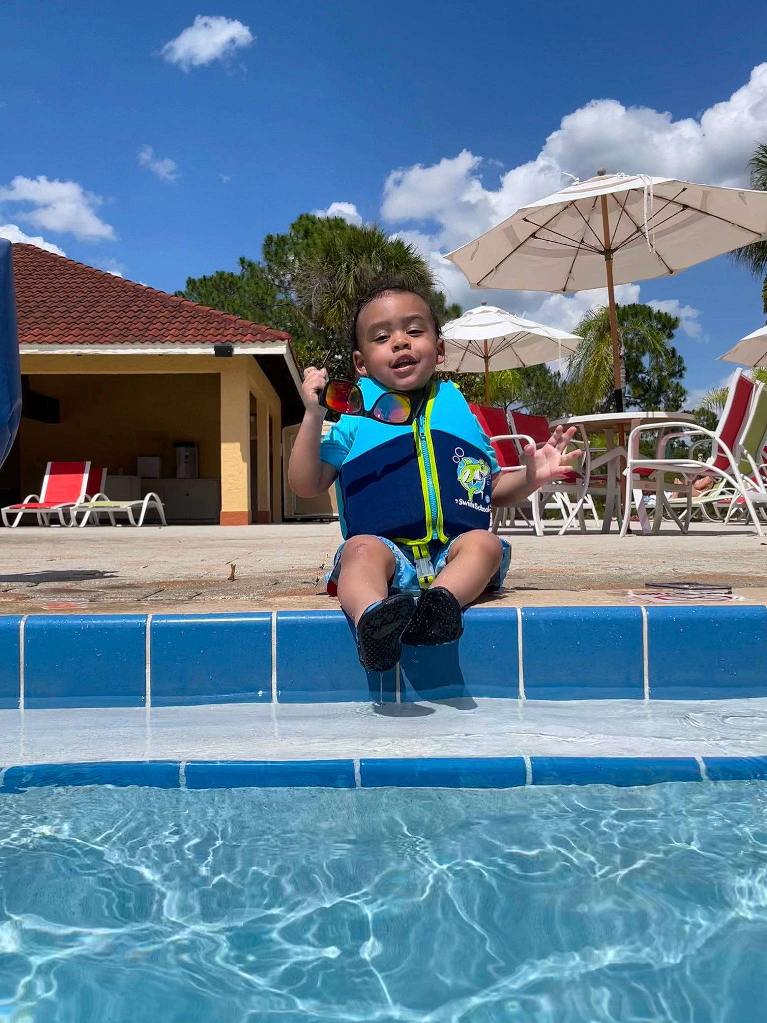 Kenai is registered to the contest to win money with this photo: azure, chair, cloud, electric_blue, fun, happy, indoor_games_and_sports, leisure, leisure_centre, outdoor_furniture, outdoor_recreation, person, personal_protective_equipment, recreation, sky, sports, summer, swimming_pool, toddler, tree