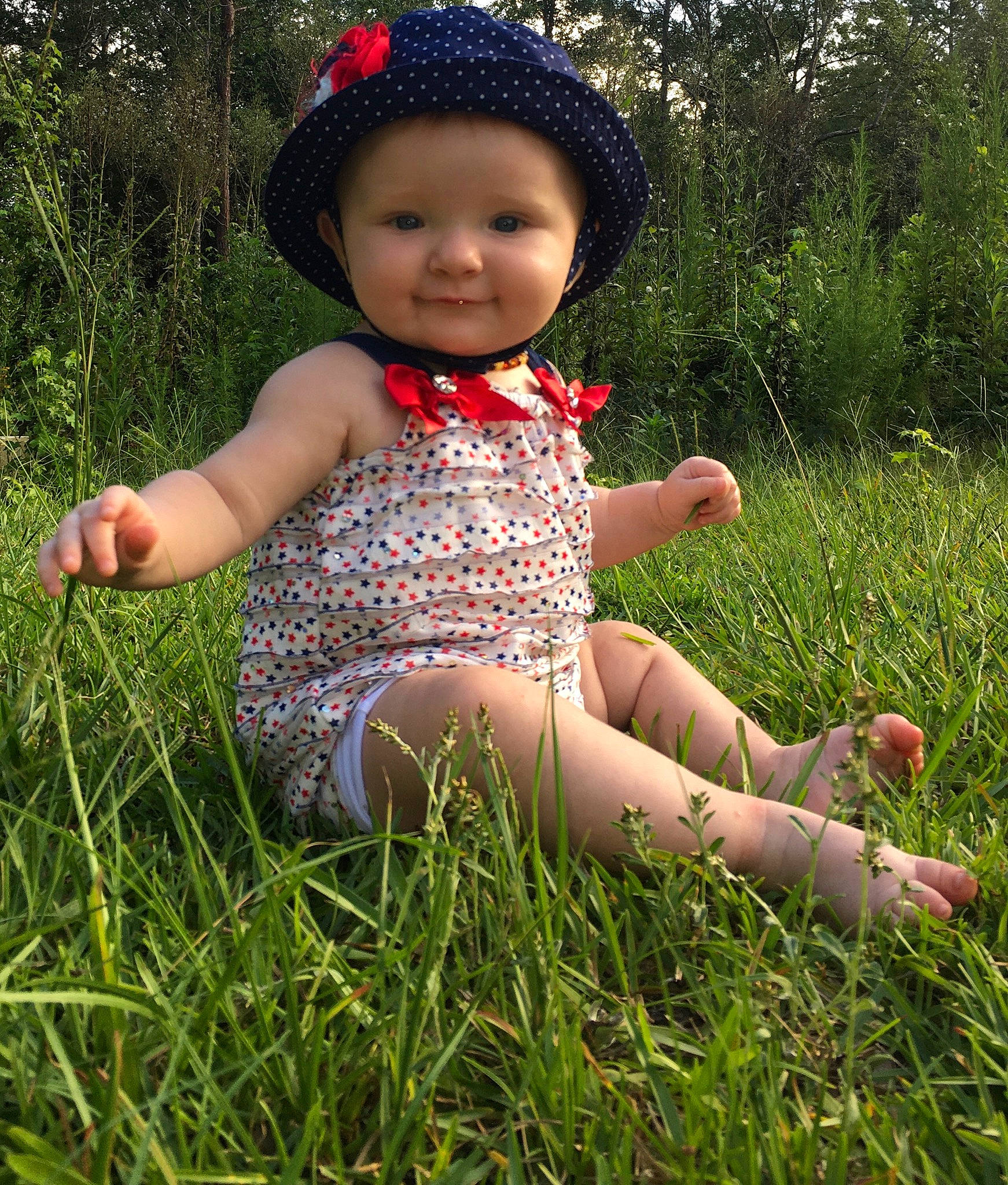 Makinleigh is registered to the contest to win money with this photo: baby, barefoot, child, finger, fun, grass, grass_family, hand, happy, headgear, headwear, joy, leg, meadow, pattern, people_in_nature, person, plant, play, sitting