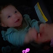 Rosalie joined the competition — help win amazing prizes! baby, infant, smiling, happy, face, hand, pacifier, clothing, dark_background, digital_hearts, cute, child, portrait, indoors, person, young_child, joyful, cozy, warm, expressive