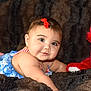 Audrey is registered to the contest to win money with this photo: baby, child, infant, red_bow, blue_outfit, stars, stripes, teddy_bear, red_toy, plush_blanket, soft_texture, cute, smiling, portrait, indoor, furniture, happy, face, lying_down, closeup