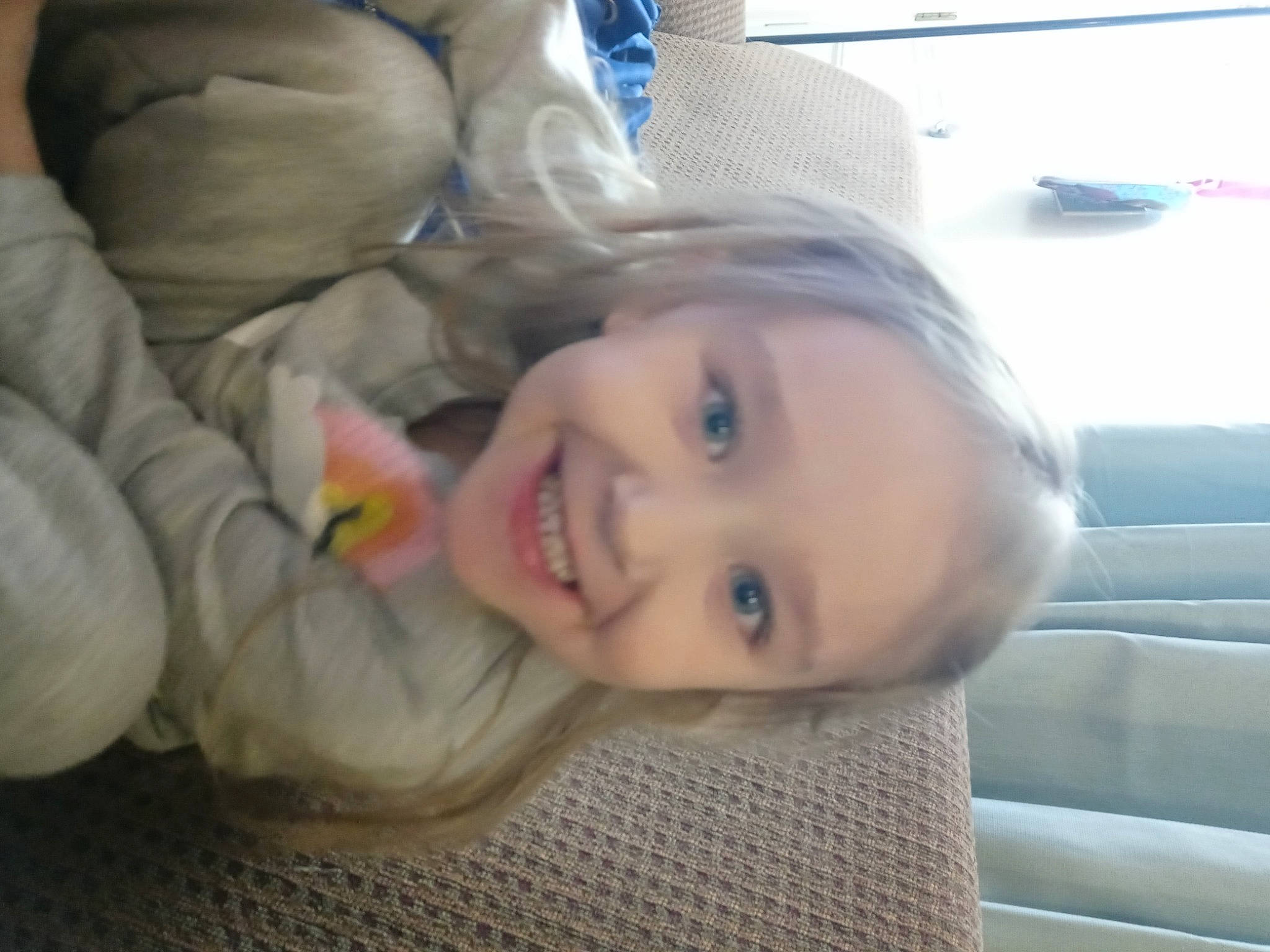 Khia joined the competition — help win amazing prizes! blond, cheek, child, comfort, floor, flooring, fun, happy, joy, lip, long_hair, mouth, nose, person, room, sitting, skin, smile, thumb, toddler