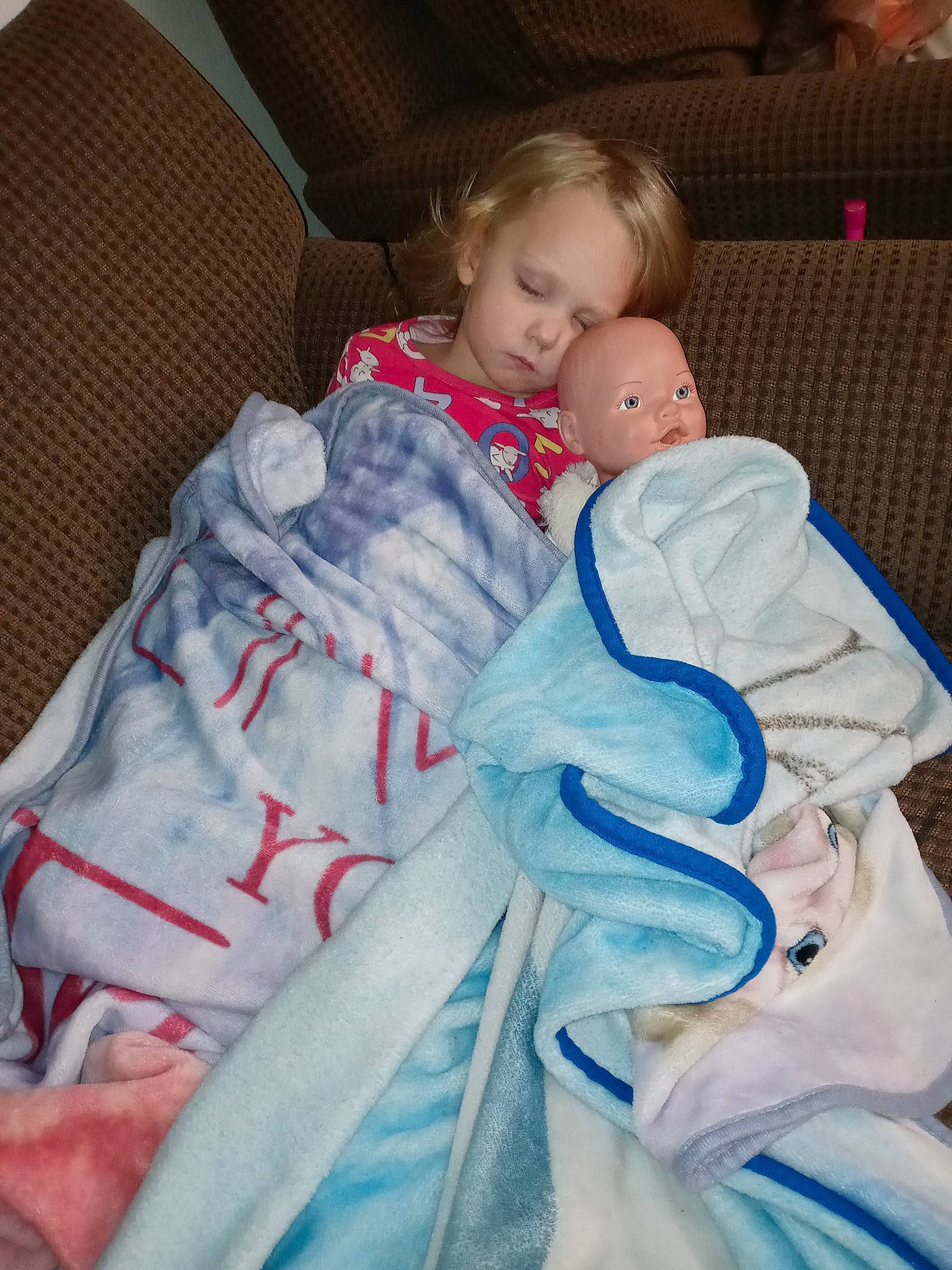 Remi joined the competition — help win amazing prizes! arm, baby, baby_products, baby_toddler_clothing, bedding, cheek, child, comfort, couch, electric_blue, eye, fun, human_body, iris, lap, linens, nose, person, sitting, textile