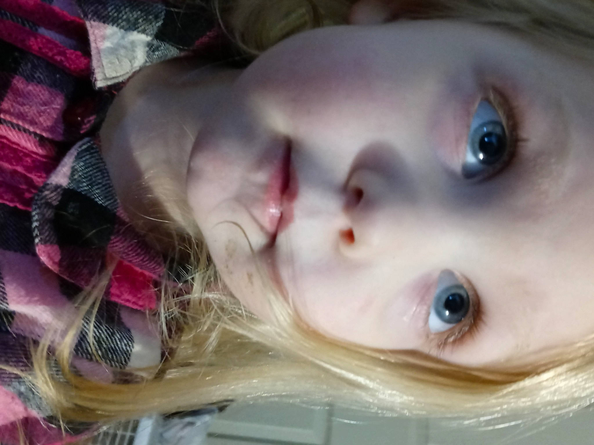 Remi is registered to the contest to win money with this photo: cheek, chin, dress, ear, eye, eyebrow, eyelash, facial_expression, forehead, human_body, iris, jaw, lip, mouth, neck, nose, organ, person, skin, toddler