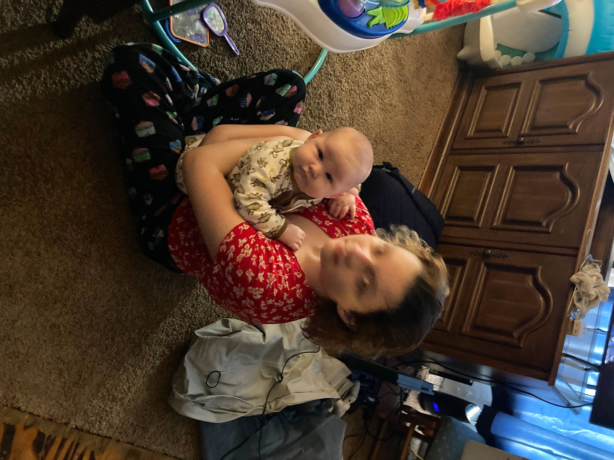 Jonathan is registered to the contest to win money with this photo: baby, baby_carriage, baby_products, baby_toddler_clothing, bag, child, comfort, flooring, fun, lap, leisure, luggage_and_bags, nap, pattern, person, room, sitting, toddler, vacation