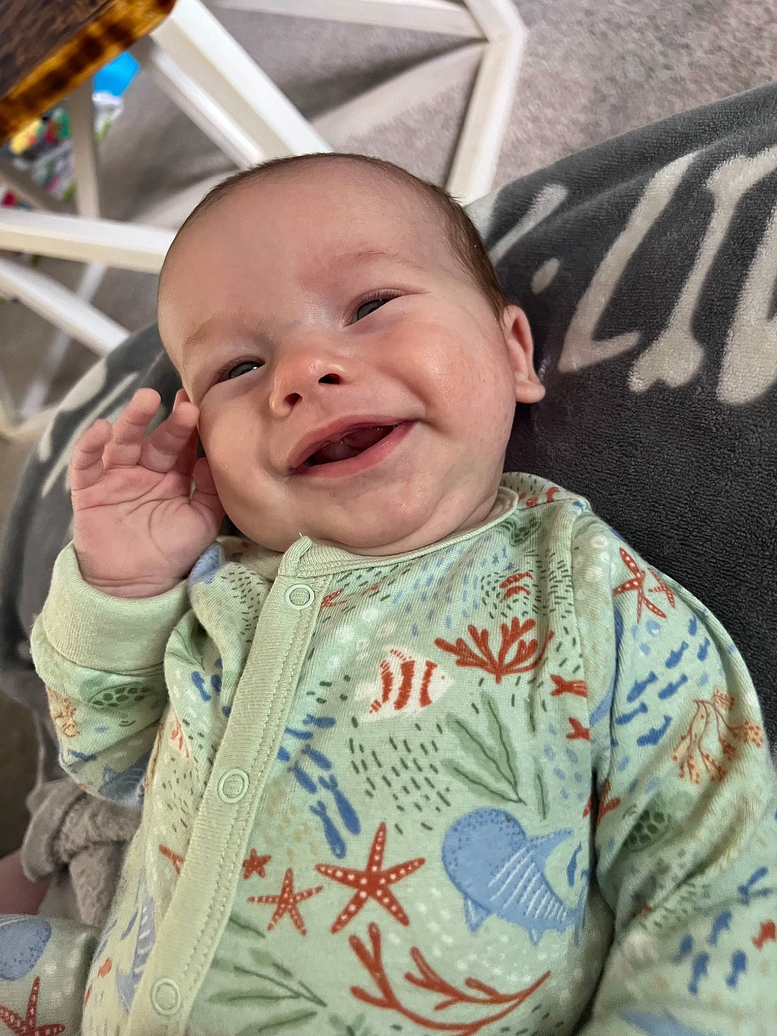 Archer is registered to the contest to win money with this photo: baby, baby_toddler_clothing, cheek, chin, eye, eyebrow, face, facial_expression, forehead, hairstyle, head, joy, lip, mouth, nose, outerwear, person, skin, sleeve, smile